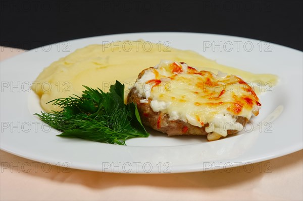 Plate with meat cutlet with cheese and mashed potato