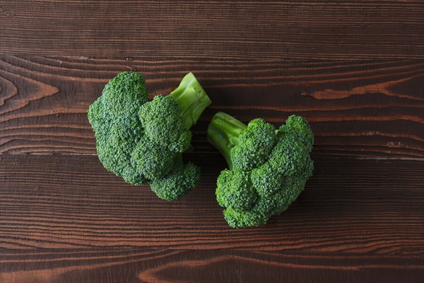 Broccoli on dark wooden background