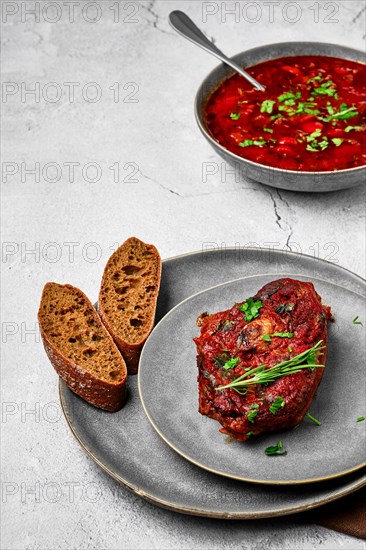 Ossobuco on a plate. Slice of shank baked with wine sauce