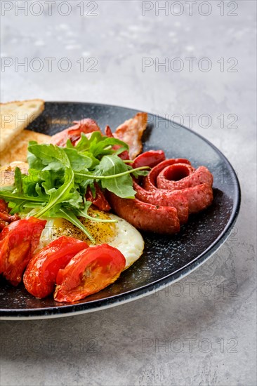 Closeup view of fried eggs with sausage