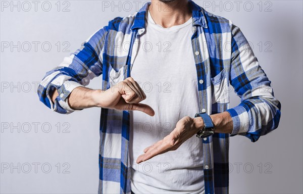 Unrecognizable deaf-mute person speaking in sign language