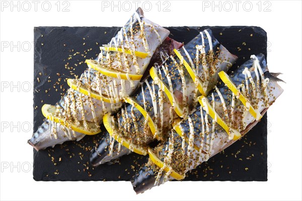 Fresh mackerel with spices and lemon ready for barbecue