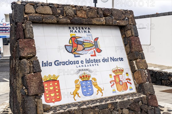 Isla Graciosa e Islotes del Norte sign informing about Nature Marine Reserve including Graciosa Island and small northern islands next to Lanzarote