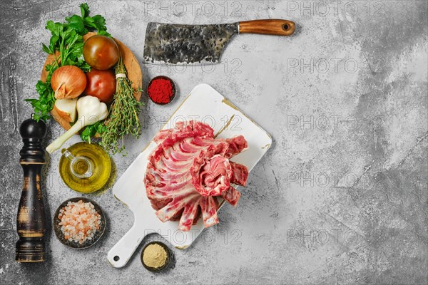 Raw fresh lamb ribs with ingredients for cooking