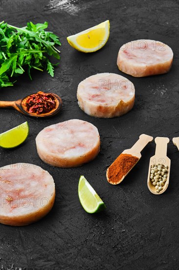 Frozen round fish cutlet with spice