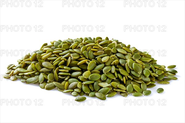 Heap of peeled pumpkin seeds isolated on white