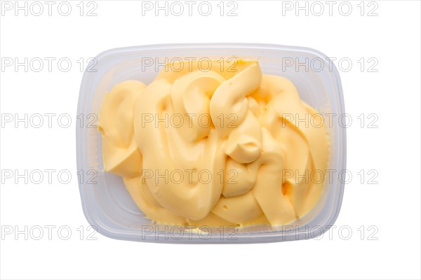 Portion of olive mayonnaise in take away packing isolated on white background