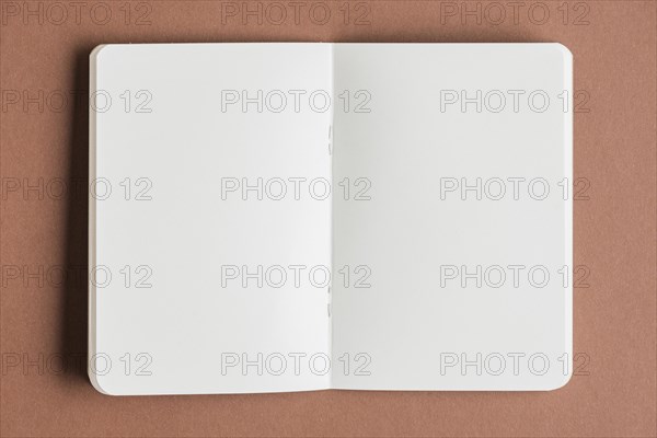 Open blank book colored background