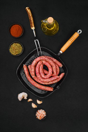 Top view of thin beef sausages on grill pan