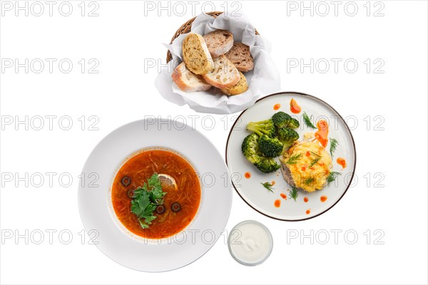 Top view of traditional solyanka sour soup isolated on white background