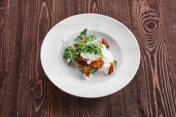 Pumpkin fritters with soft cheese and sun-dried tomato