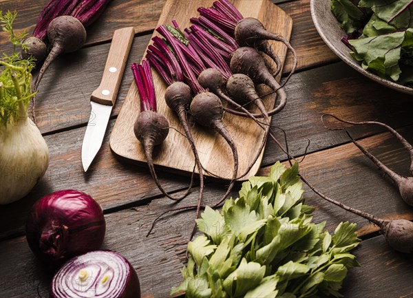 Fresh beet cutting board flat lay