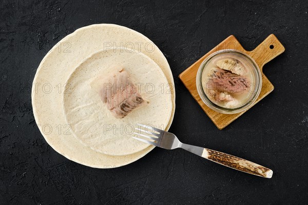 Top view of canned sturgeon on a plate