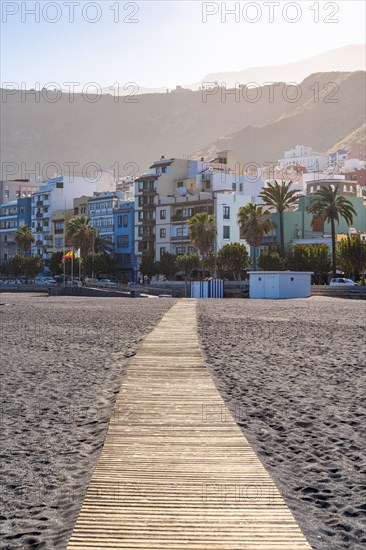 Wooden plank path on the beach of the capital Santa Cruz