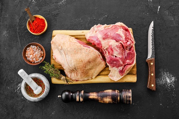 Top view of raw fresh turkey thigh with spices