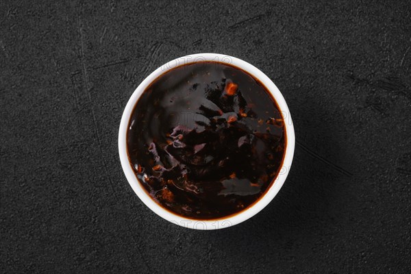 Overhead view of small bowl with spicy teriyaki sauce