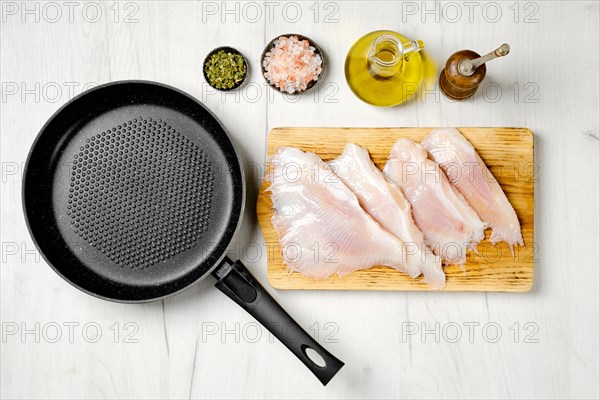 Top view of raw fresh peeled stingray wings ready for frying