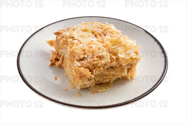 Napoleon cake on plate isolated on white background