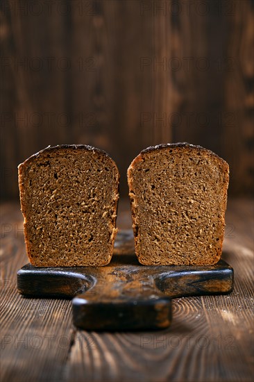 Loaf of artisan rye bread cut on half