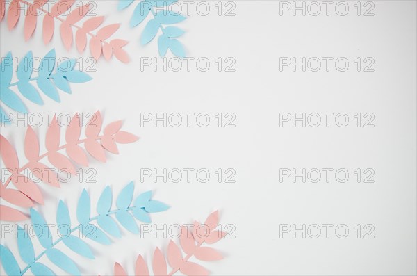 Grey copy space background with pink blue foliage