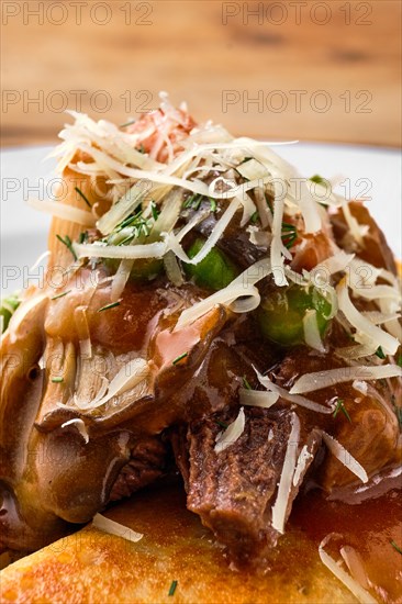 Macro photo of forest mushroom sauce on top of the food