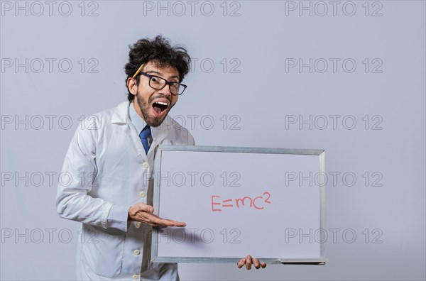 Physics professor holding whiteboard with a mathematical formula. Scientist holds and points to a whiteboard with a mathematical formula. Scientist showing blackboard with mathematical equation