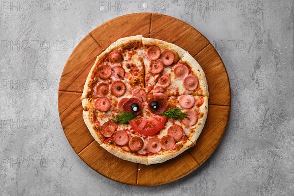 Top view of pizza for kids with sausage and cheese