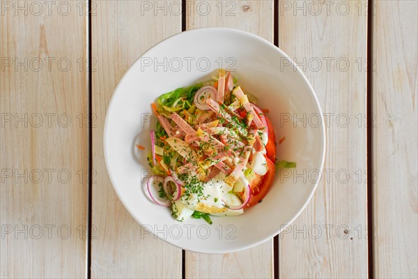 Top view of salad with ham