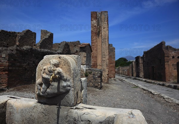 Fountain in one of the former residential streets in Pompeii