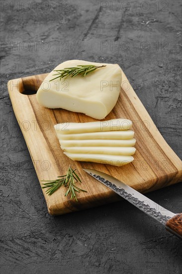 Homemade country style goat cheese on cutting board