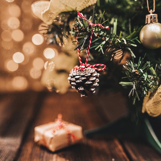 Little decorated fir tree on wood desk