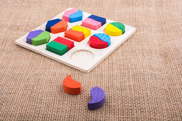 Colorful wooden pieces of a logic puzzle