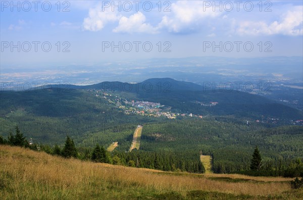 View from the mountains to the city in the background