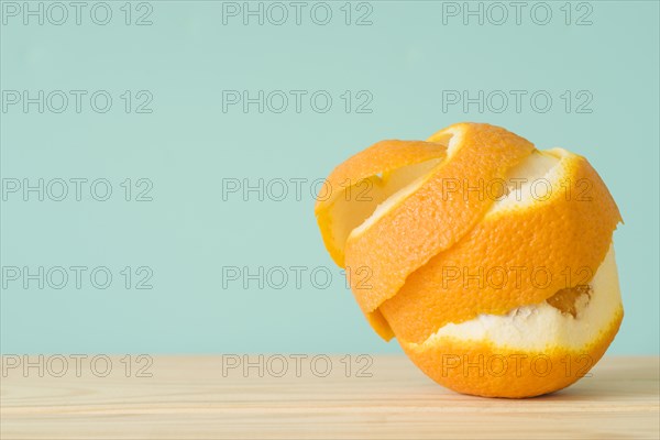 Close up peeled orange fruit wooden surface