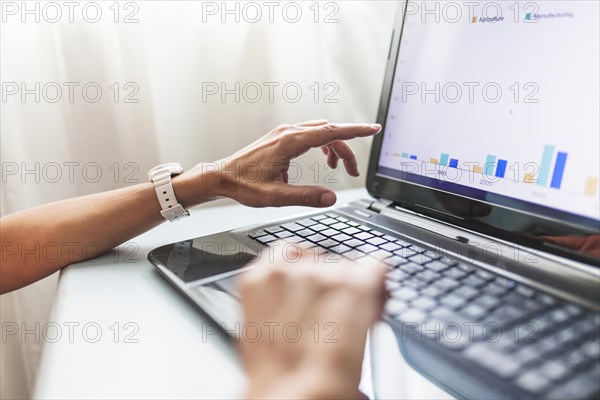 Crop hands using laptop office