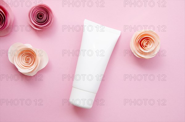 Flat lay arrangement with cream bottle roses