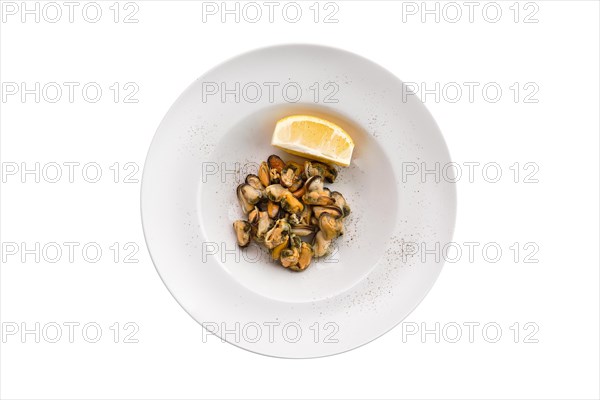 Marinated mussels and slice of lemon isoalted on white background