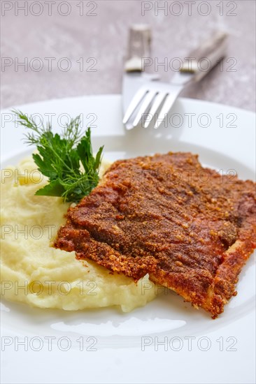 Fried hake fillet with spinach