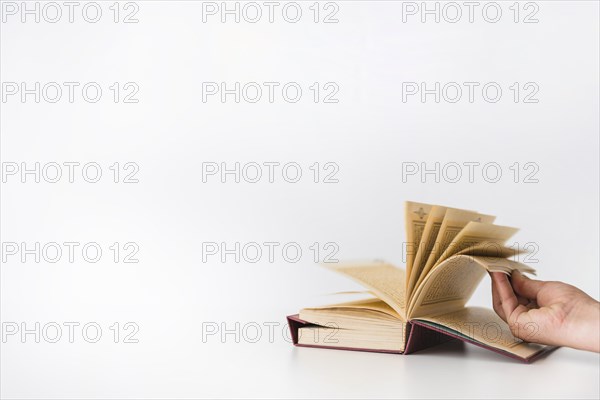 Hand turning pages book