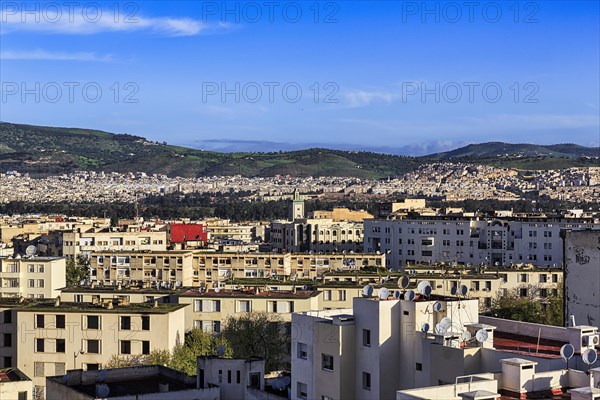 Panoramic view over the houses to the surrounding hills