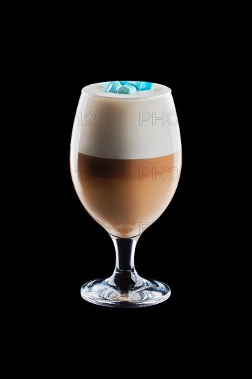 Big transparent glass with layered latte isolated on black background