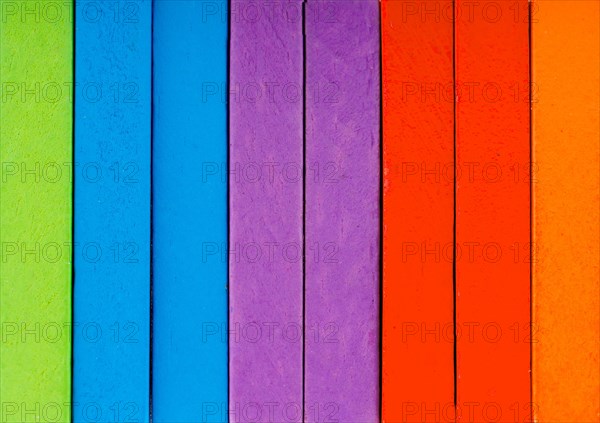 Colorful Domino Blocks in a line on a white background