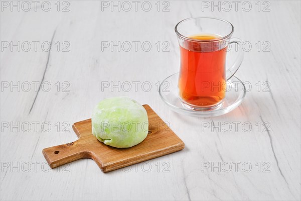 Sweet dessert mochi with kiwi with fruit tea