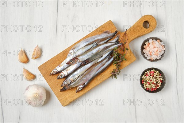 Top view of pile of fresh raw frozen capelin