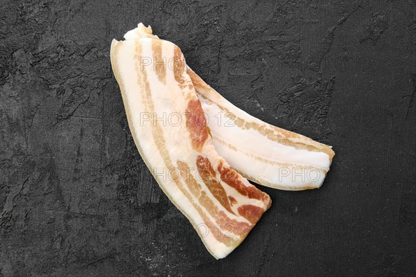 Top view of two slices of bacon on the table