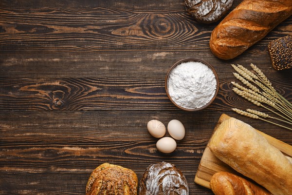 Assortment of cereal bread made of different seeds on wooden table