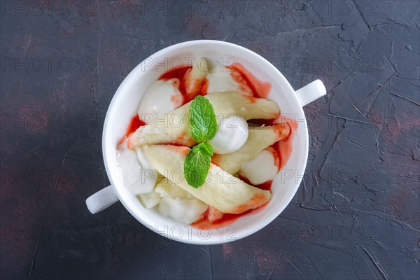 Lazy dumplings with sour cream and strawberry jam