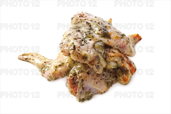 Raw piece of chicken with spice and sauce prepered for barbecue. Gastronomy template isolated on white background