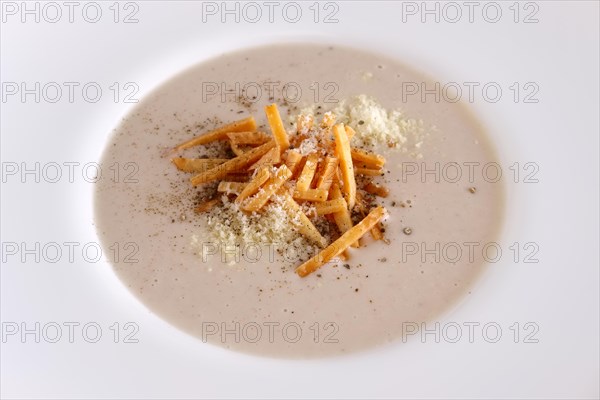 Mushroom soup puree with bacon flakes