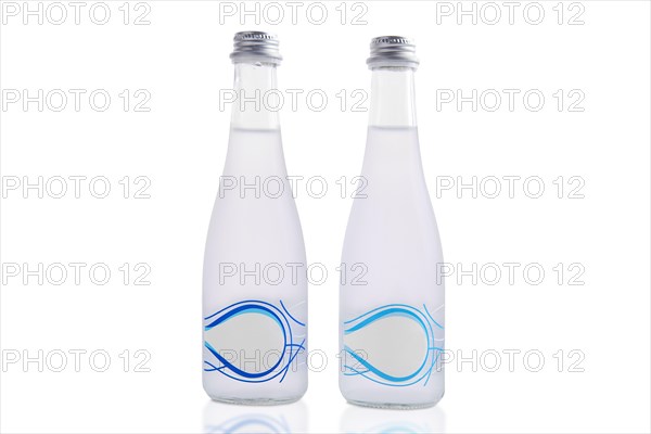 Two bottles of mineral water isolated on white background
